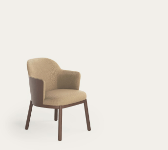 Aleta Mini armchair by Jaime Hayon for Viccarbe, upholstered in sand-coloured fabric with a walnut-toned wooden outer shell and four wooden legs.