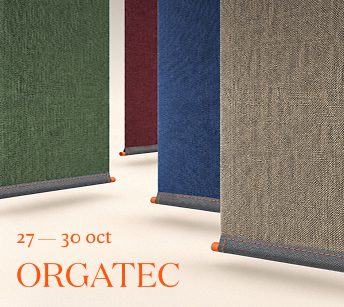 Hanging fabric panels in green, red, blue and beige with the text “27—30 oct. Orgatec”