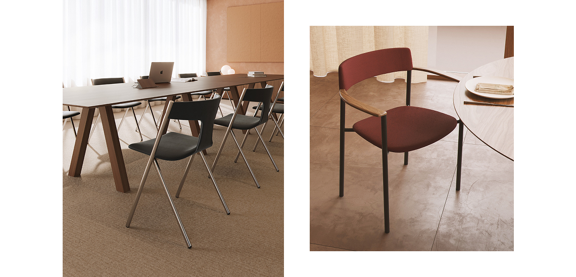 Quadra chairs upholstered in black in a meeting room, and Perxa chair upholstered in burgundy with wooden armrests beside a table